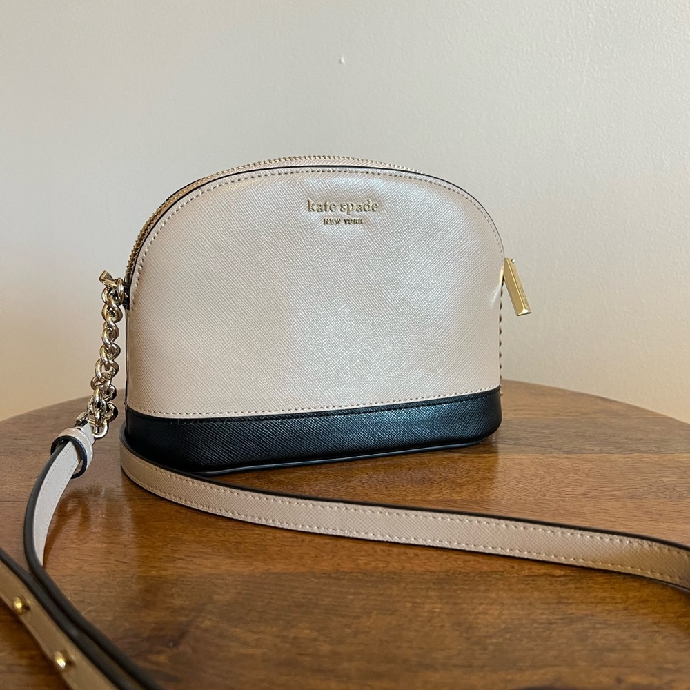 Kate Spade dome crossbody purse. Nude/beige and black color